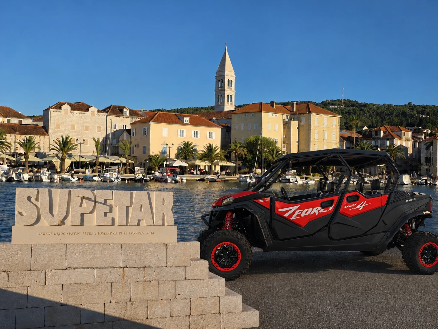Supetar waterfront, SUPETAR stone sign and Rentamotorino CFMOTO buggy on Brač