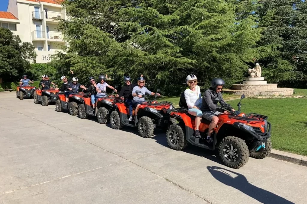 Group of riders lined up on quad bikes during a safari tour on Brač